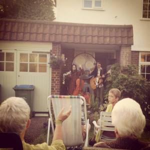 Our first show of the UK tour.. and its on the front porch of a house in Surbiton, Surrey.  Mark, Sarah and Jessica supported our new album crowd funding project by purchasing a house concert for their friends and family! It was a great concert and a wonderful afternoon all round!
